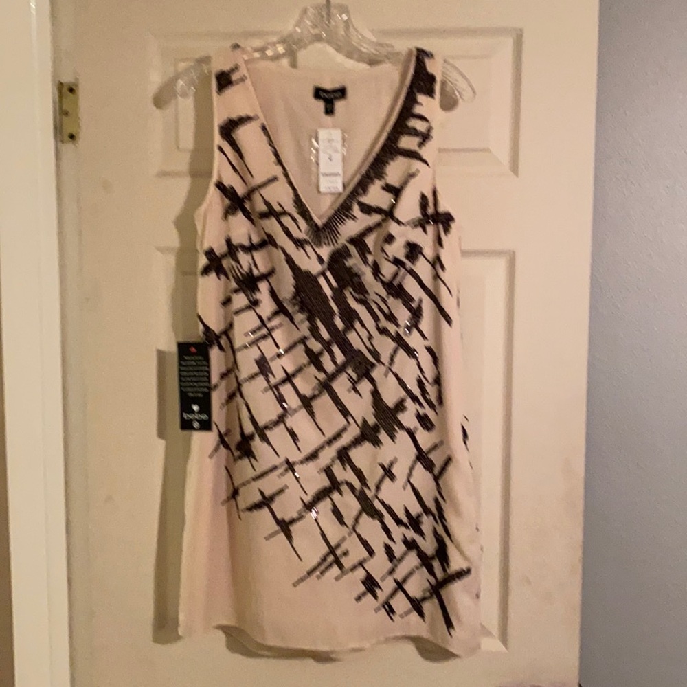 bebe cream shift dress with black sequins.